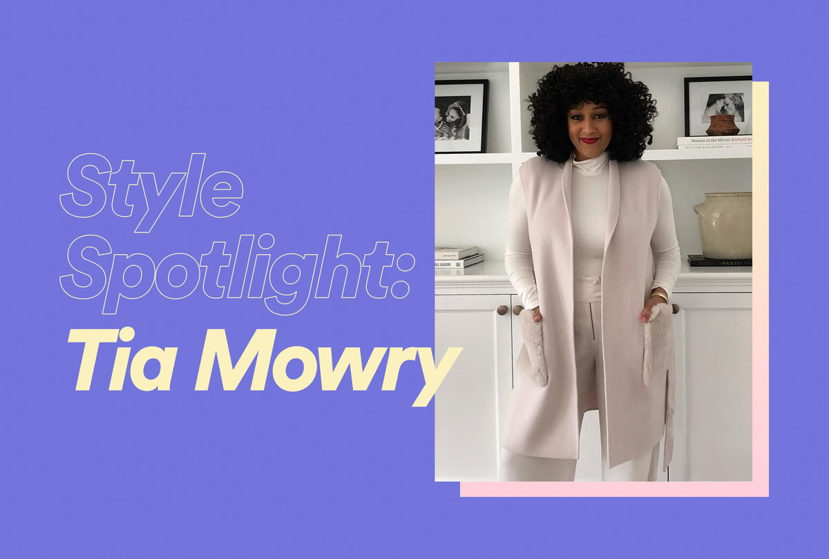 Tia Mowry wearing her natural curls at a red carpet event