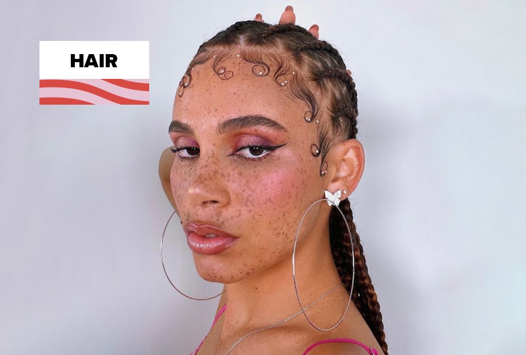 Baby hairs laid into swoops and curls along a hairline