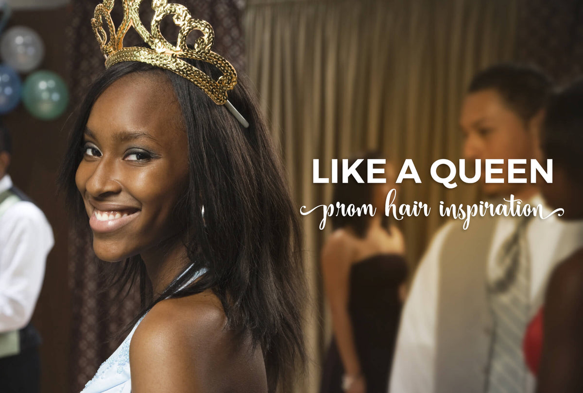 Black teen wearing an elegant swept updo styled for prom night