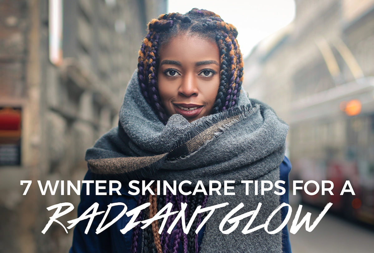 Black woman with glowing skin bundled up outdoors in cold winter weather