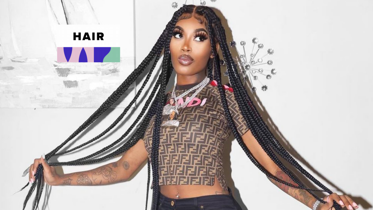 Female rappers wearing bold wigs and colored hairstyles on stage