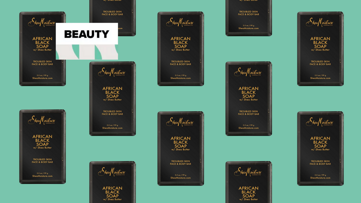 Bar of African black soap resting beside a washcloth