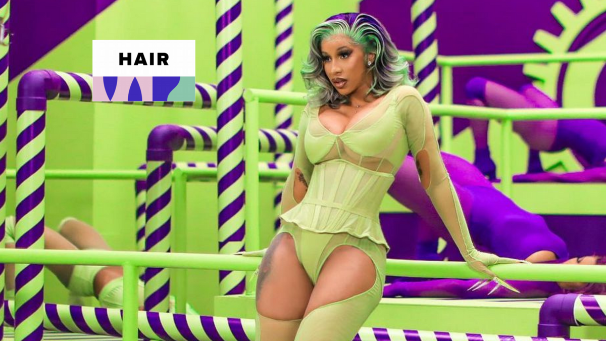 Cardi B wearing long colored hair at a red carpet event