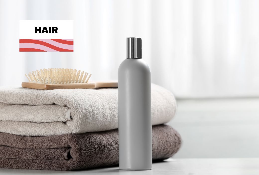 Shampoo bottle label being read for ingredients before wash day