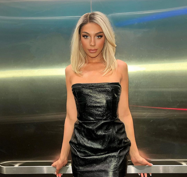 Model wearing Mayvenn #613 Blonde Straight Standard Lace Front Wig