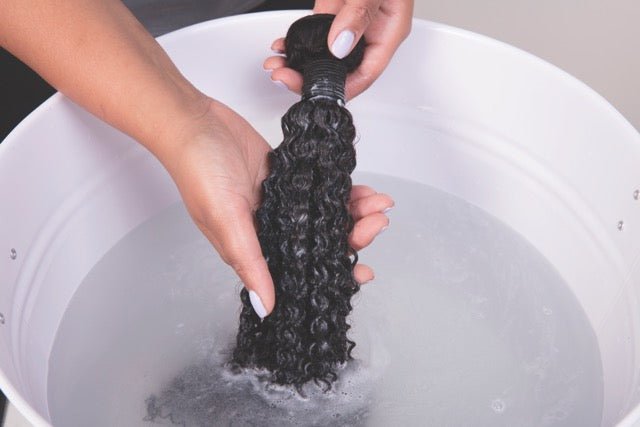 Hair extensions being brushed and conditioned as part of regular maintenance