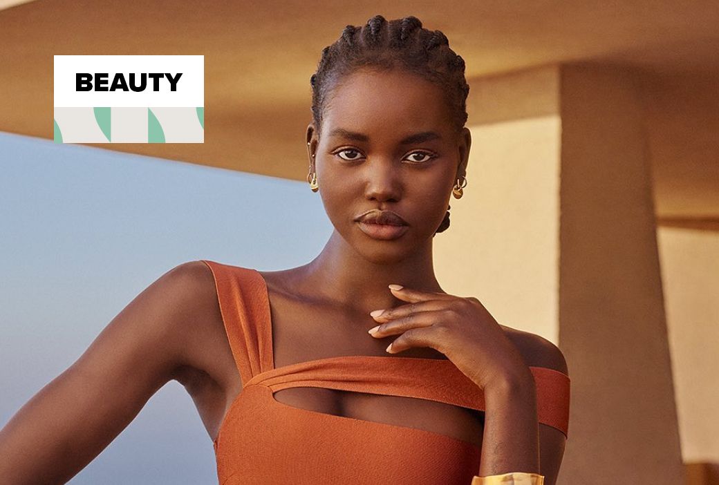 Model Adut Akech Bior wearing a sculpted short natural hairstyle