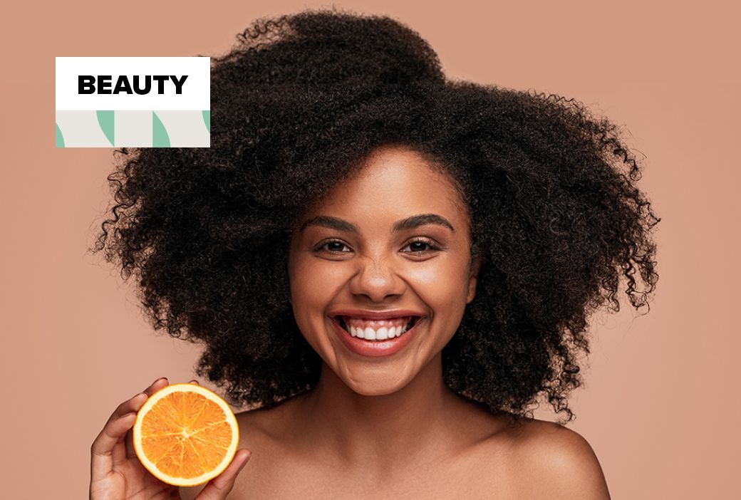 Vitamin C serum and retinol bottles set out for a skincare regimen