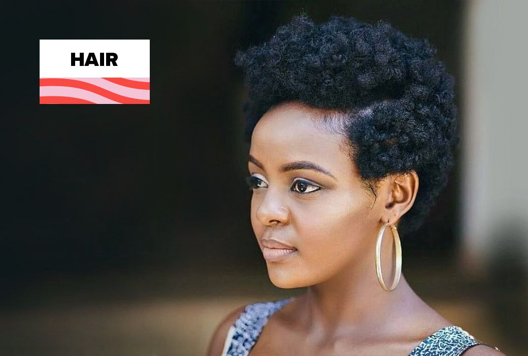 Black woman smiling with a short cropped cut after a spontaneous big chop