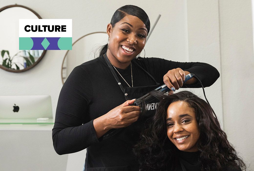 Client booking a future salon appointment on her phone to support her stylist