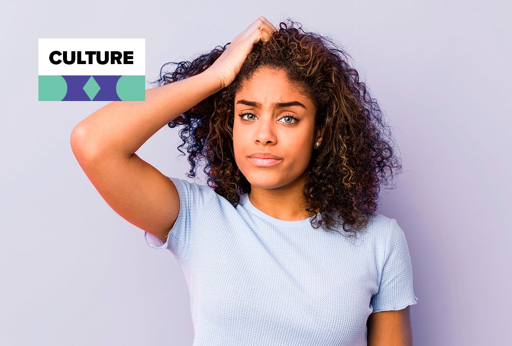 Black woman sitting with unstyled hair on a difficult mental health day
