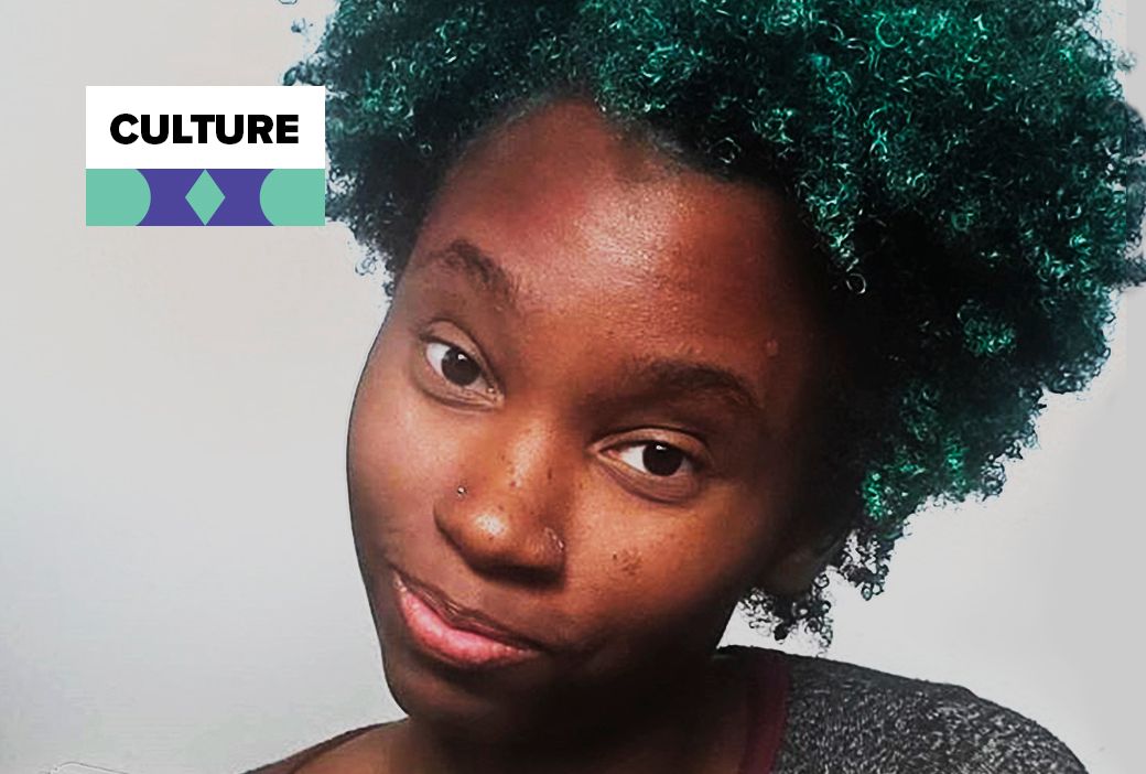 Black woman wearing vivid green hair styled in loose waves
