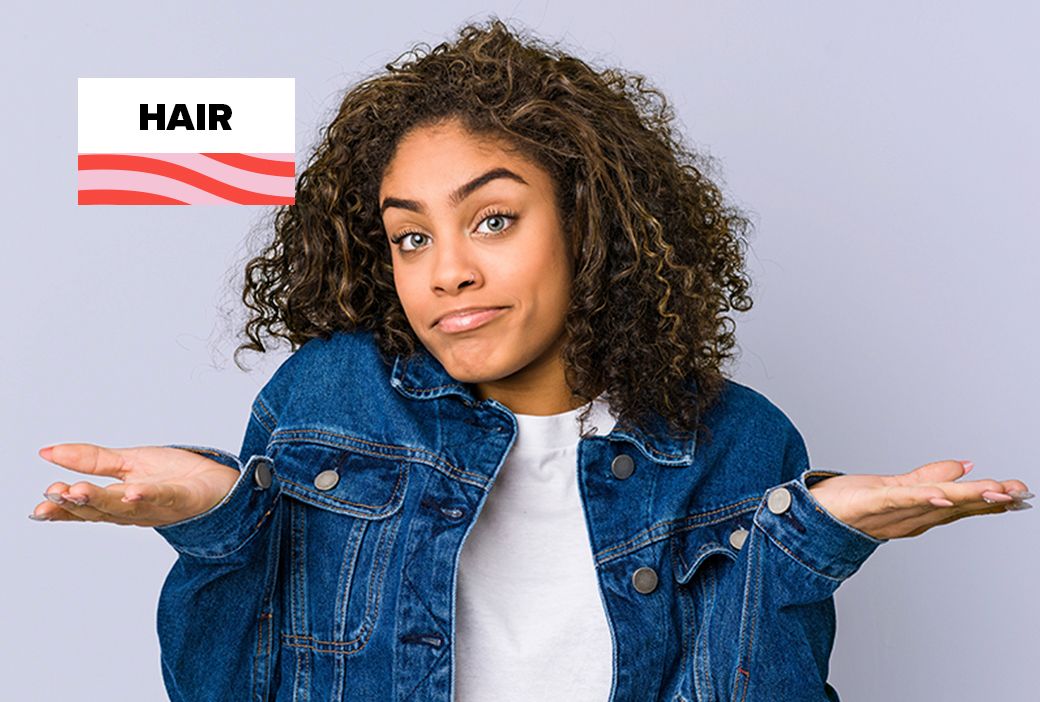 Woman with an unstyled protective style sitting at home with nowhere to go