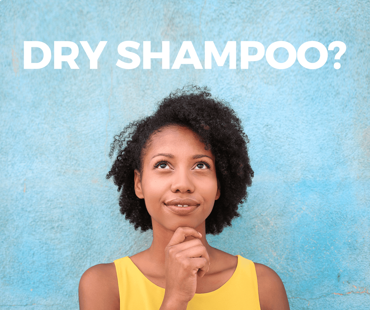 Bottle of dry shampoo used to refresh roots between wash days