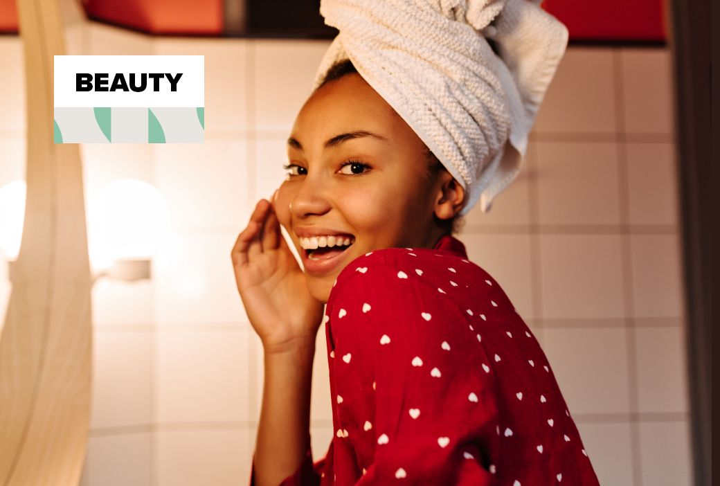 Woman washing her face at a sink with a gentle cleanser