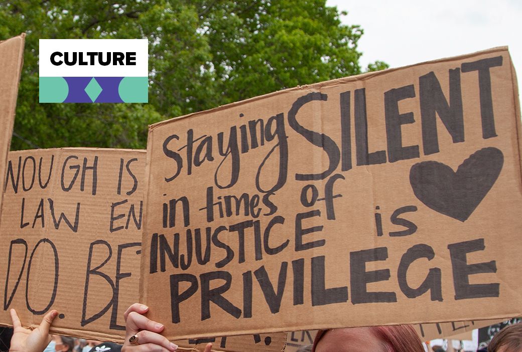 Protest signs raised during a demonstration against racial injustice