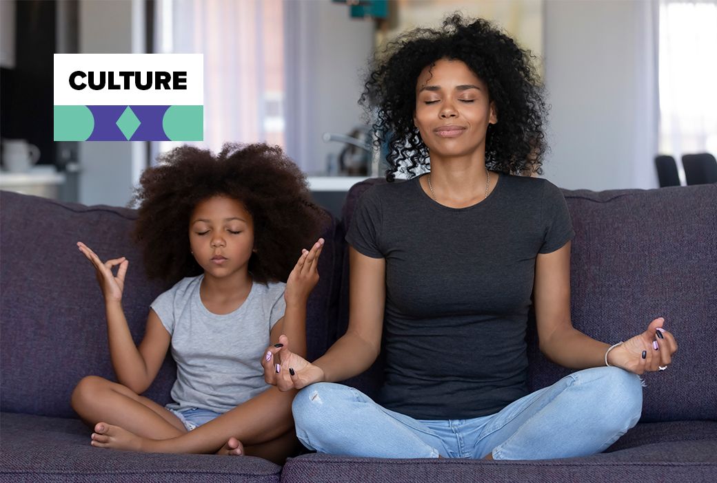 Mother taking a quiet break at home while her children play nearby