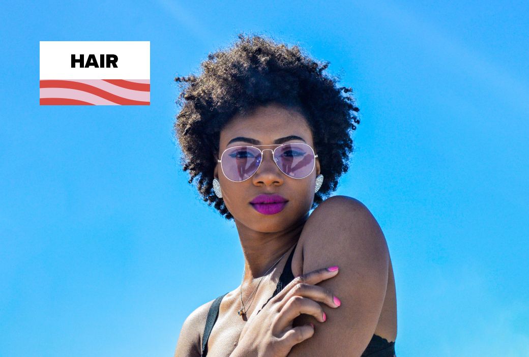 Black woman wearing an afro in a professional workplace setting