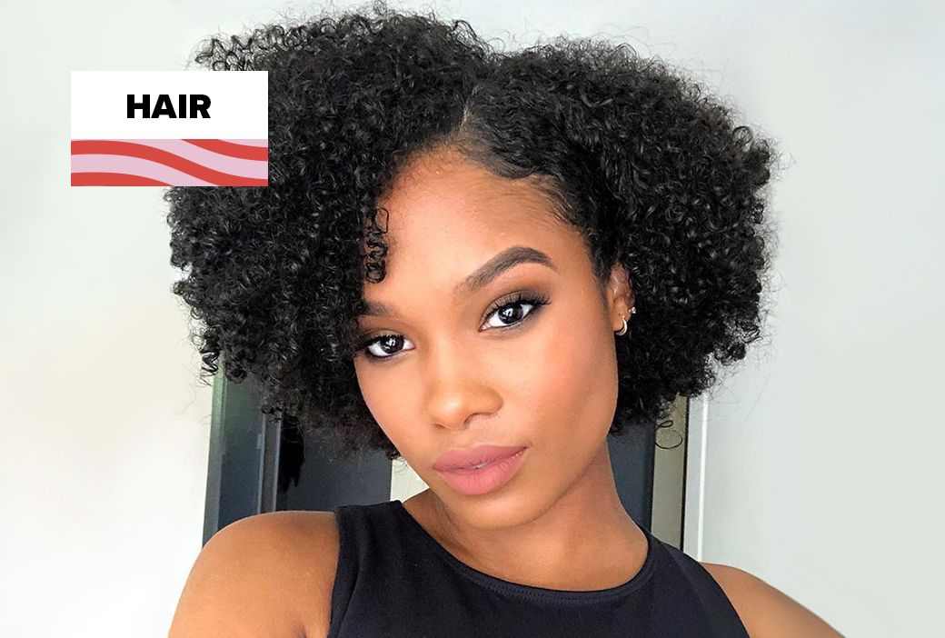 Black woman wearing a short tapered cut styled for fall