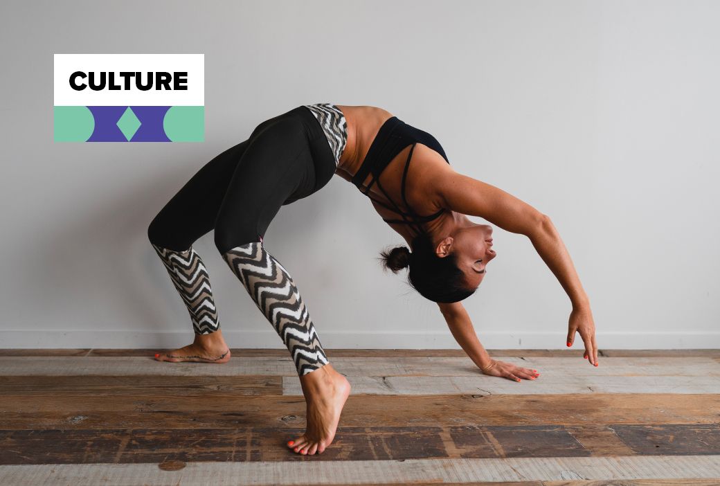 Woman stretching on a mat during a stress-reducing home workout