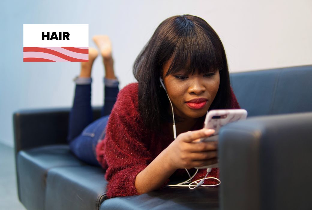Creator filming a hair tutorial on a phone for social media