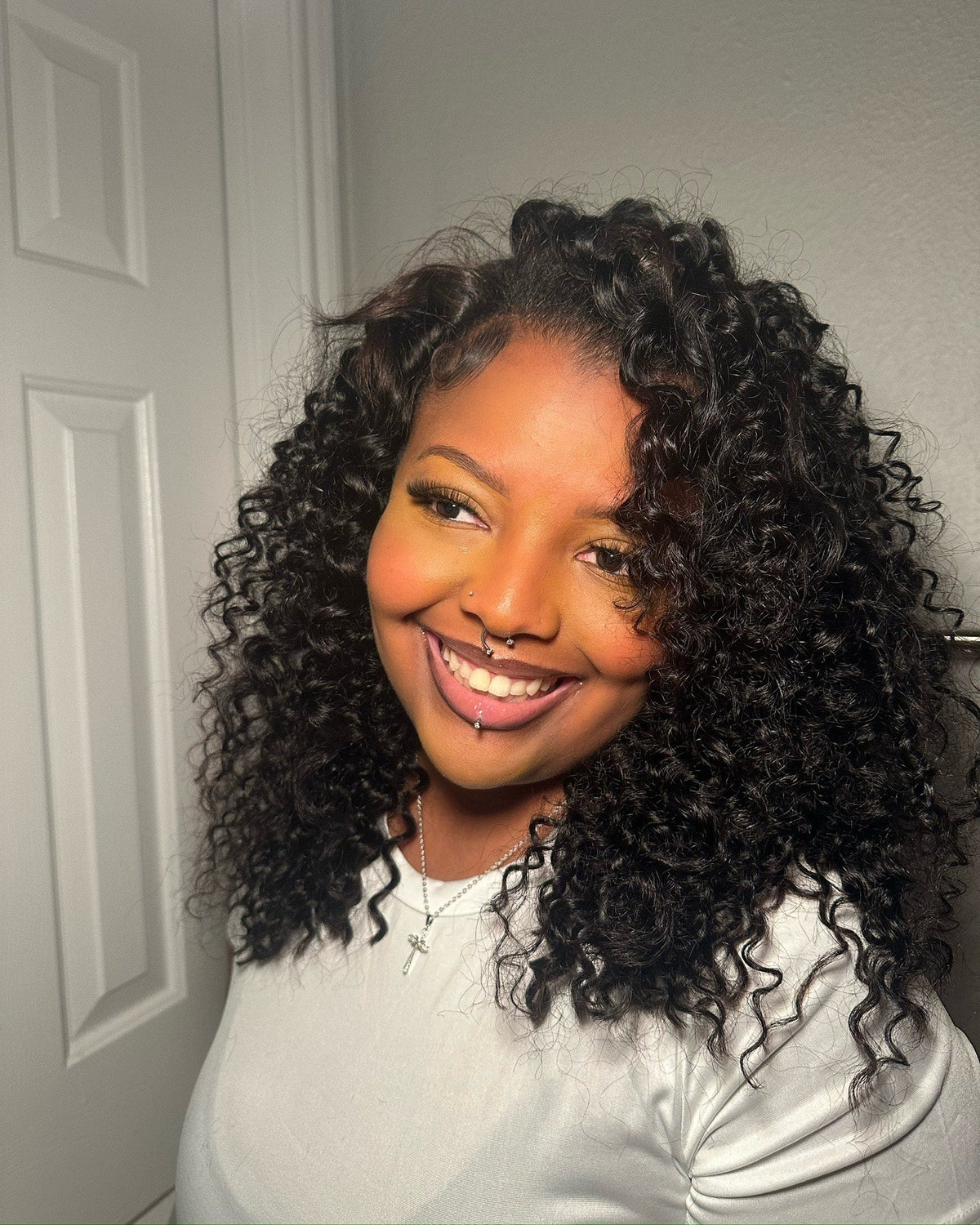 A Mayvenn customer wearing a curly human hair install