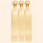 Three #613 blonde straight human hair bundles standing side by side