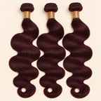 Three 99j burgundy body wave human hair bundles standing side by side
