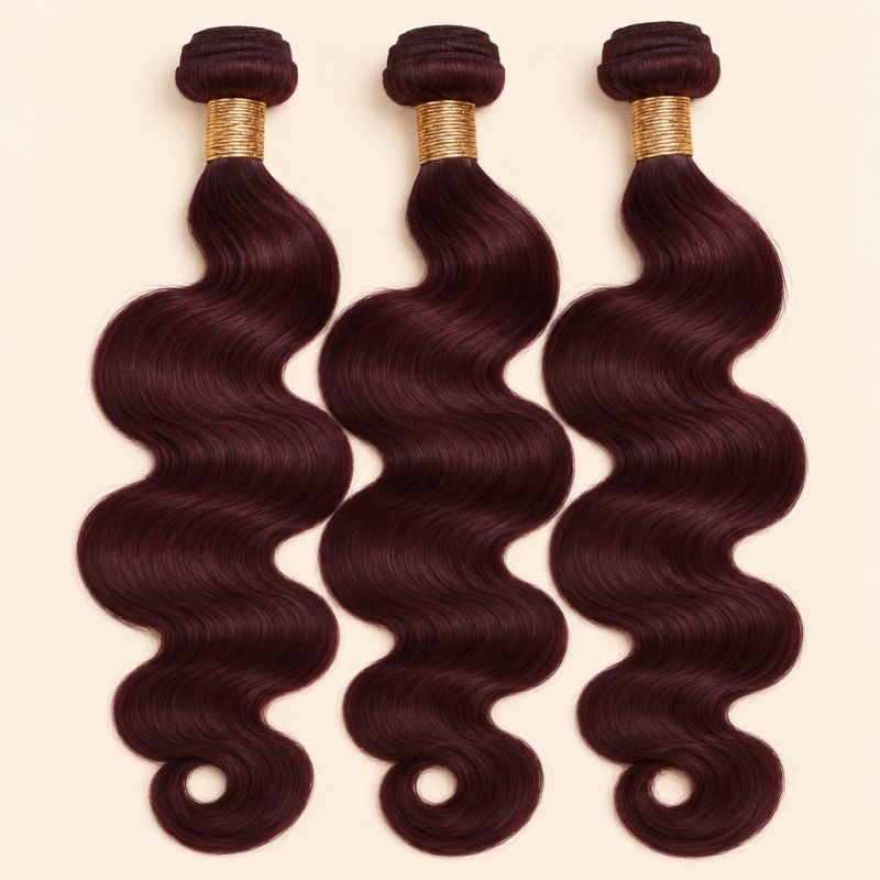Three 99j burgundy body wave human hair bundles standing side by side