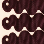 Three 99j burgundy body wave wefts laid flat, showing the staggered lengths