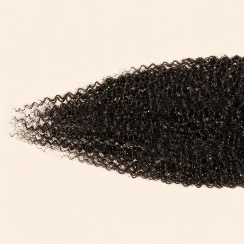 Narrow transparent lace parting space on an afro kinky curly deep part closure