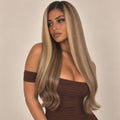 Model wearing the Sunbeam glueless 5x5 HD closure wig in golden blonde