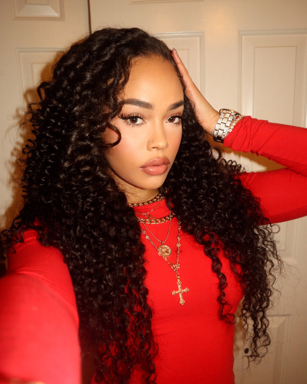 Model with a middle part Brazilian deep wave install styled long