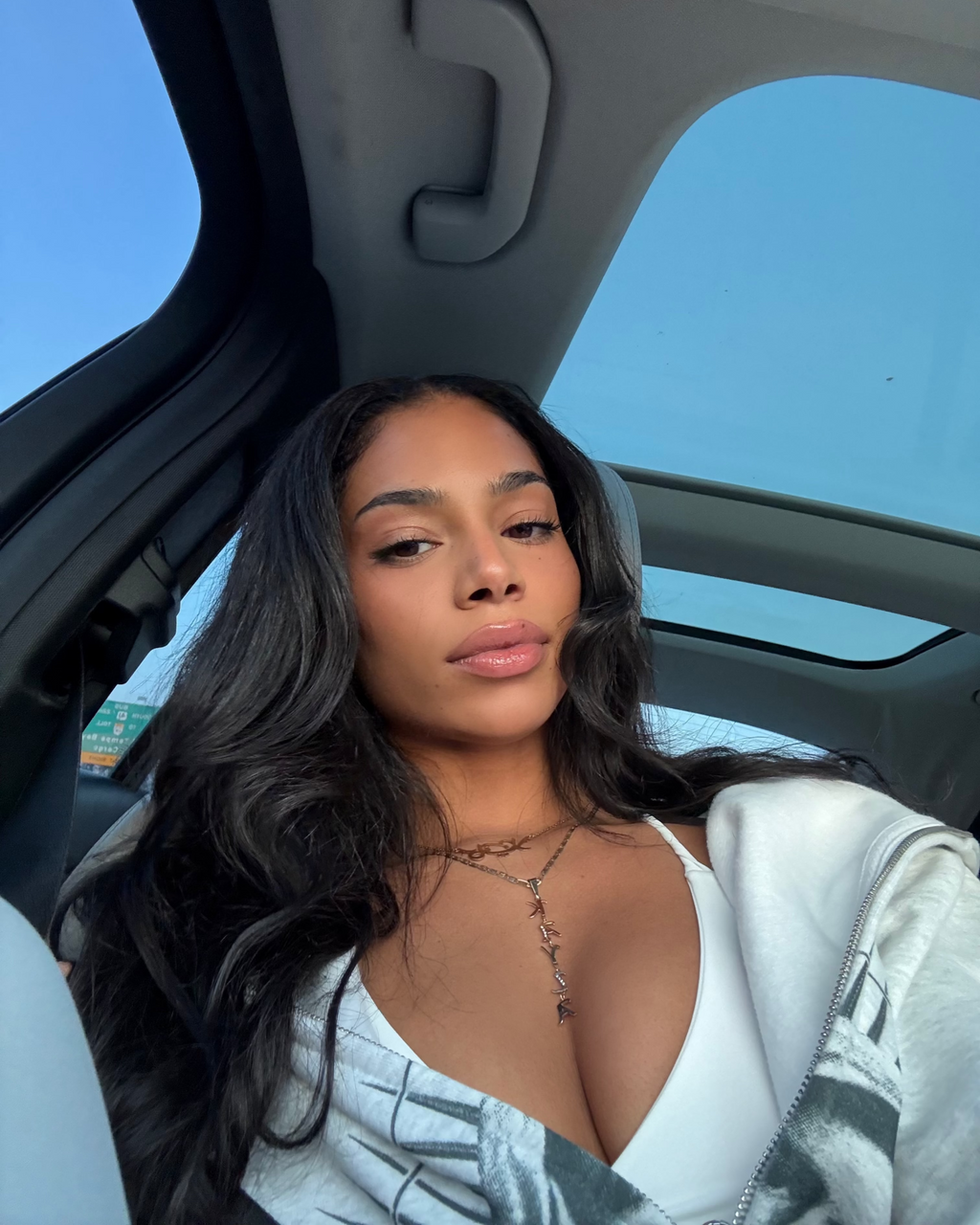 Model with a middle part Malaysian body wave install styled loose