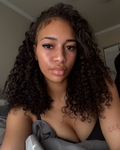Three natural black Brazilian water wave bundles stacked for a full sew-in