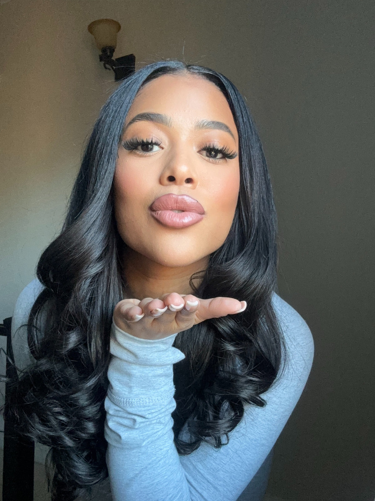 Natural black virgin Malaysian body wave bundle laid flat showing full length