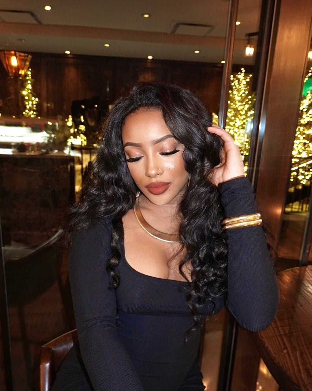 Natural black virgin Brazilian loose wave bundle laid flat showing full length