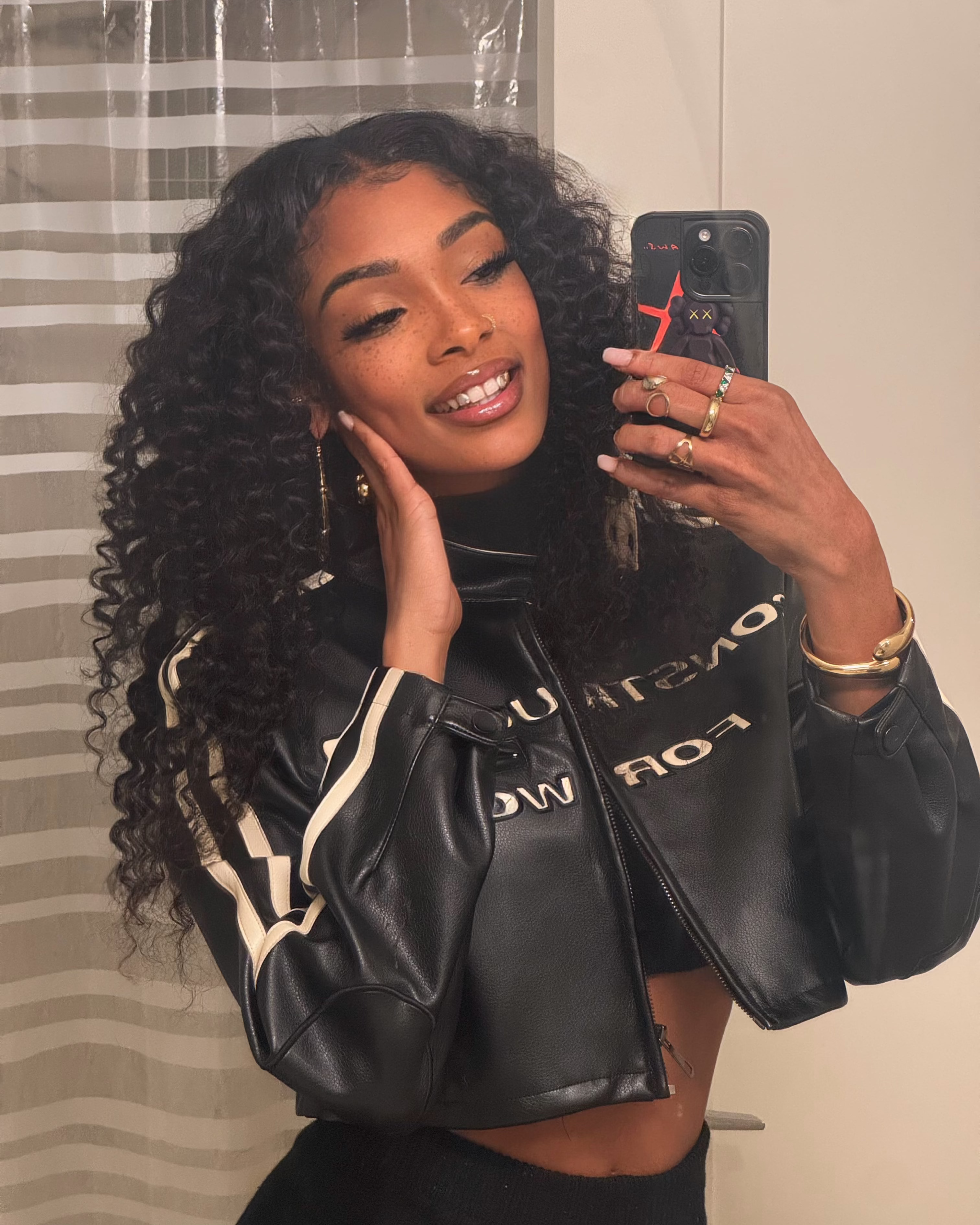 Natural black virgin Brazilian deep wave bundle laid flat showing full length