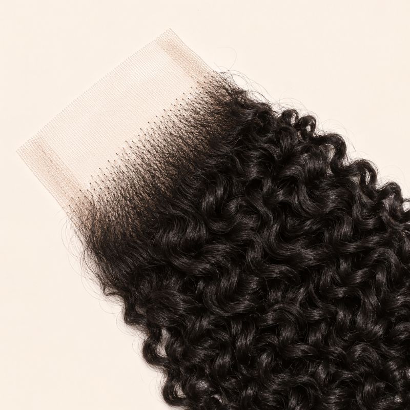 Glossy jerry curl coil on virgin human hair in a 2x6 transparent lace closure