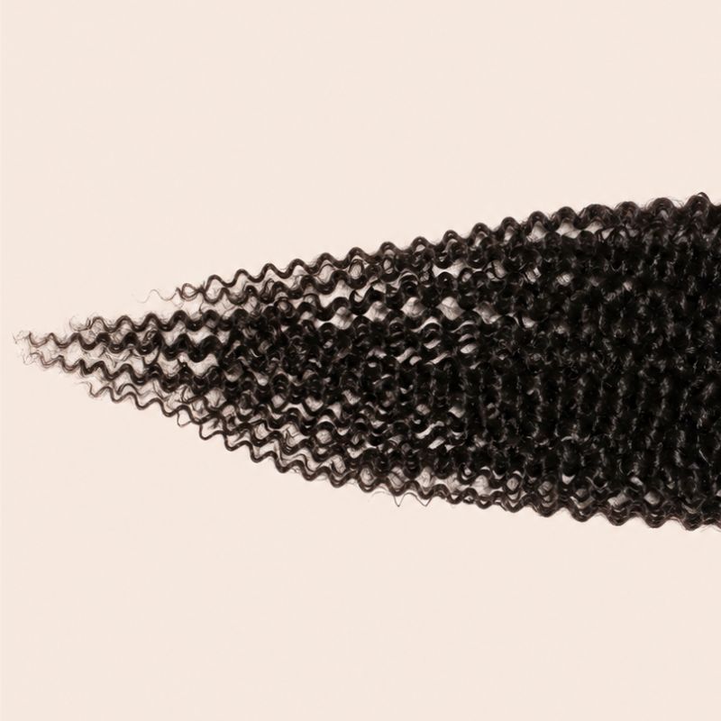 Narrow transparent lace parting space on a jerry curl deep part closure