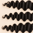 Three loose wave wefts laid flat, showing the staggered lengths