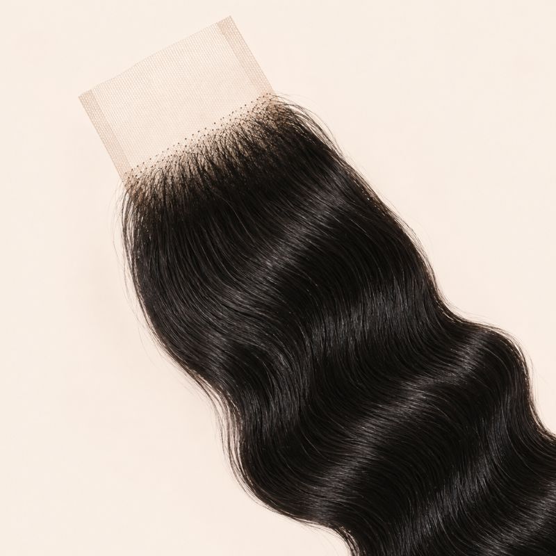Soft loose wave pattern on virgin hair tied into a 2x6 lace closure