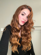 Seamless clip-in extension weft held against the scalp for placement