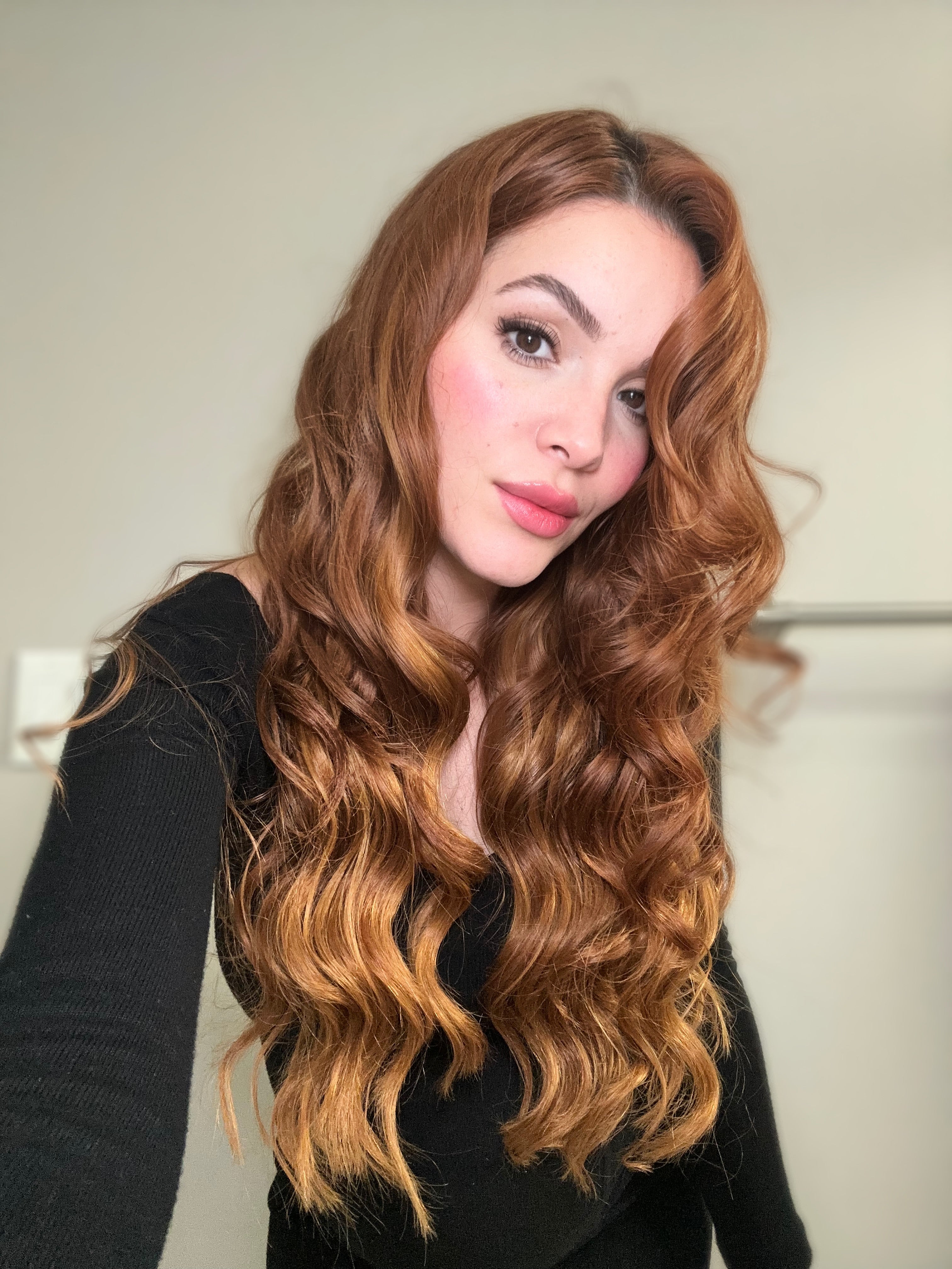 Seamless clip-in extension weft held against the scalp for placement
