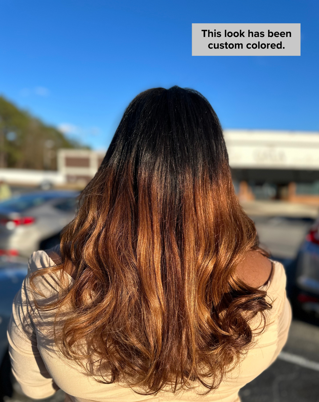 Long natural black Malaysian body wave install styled with a side part