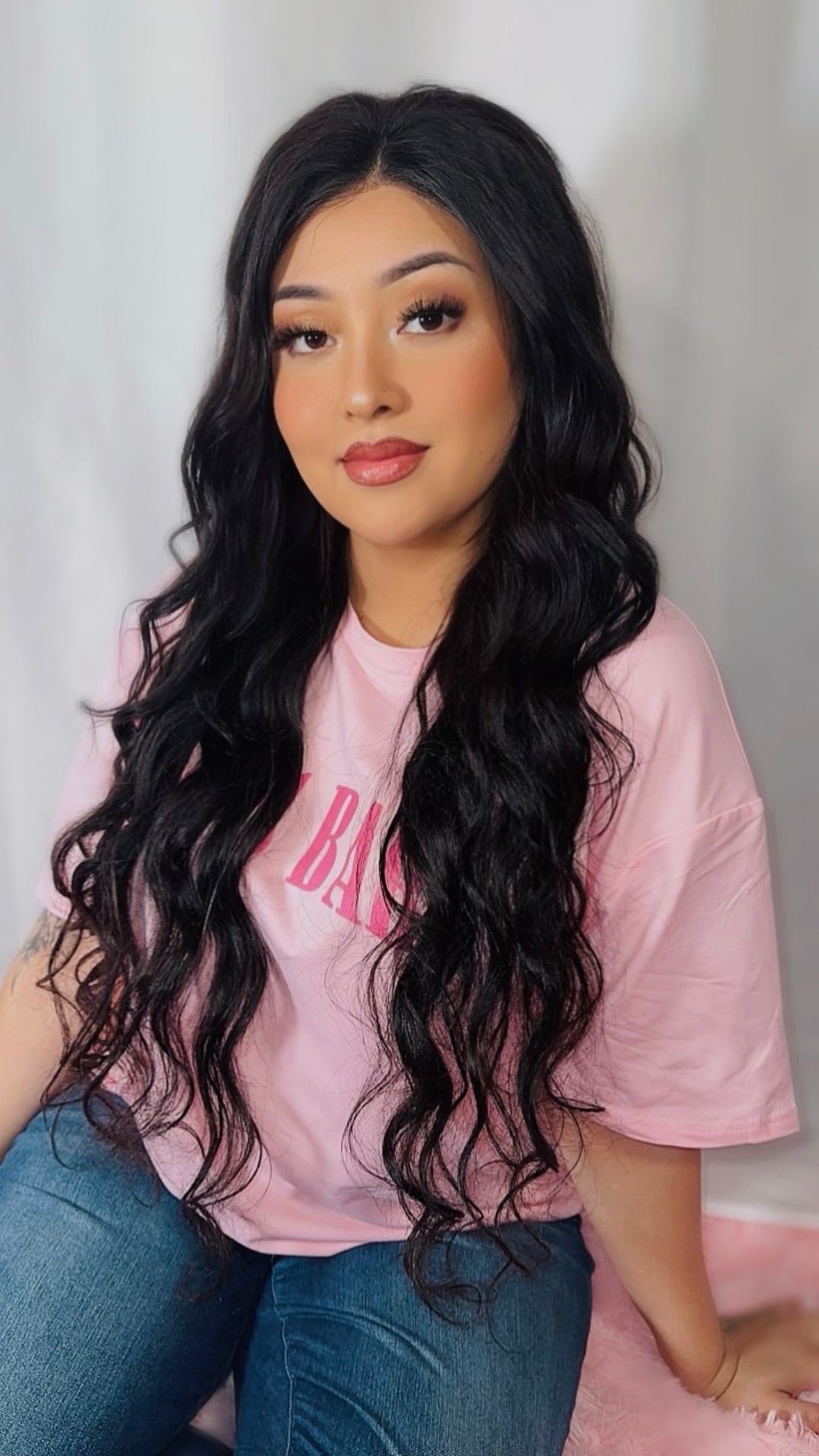 Model wearing a natural black body wave 4x4 lace closure, front view