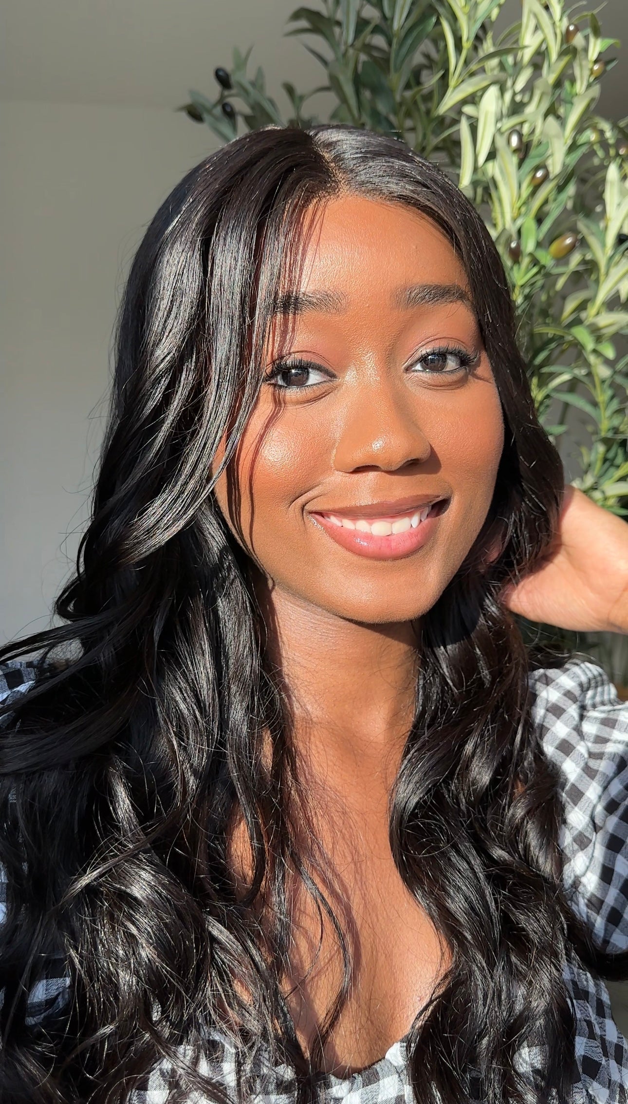 Malaysian body wave hair falling in soft waves down the model's back