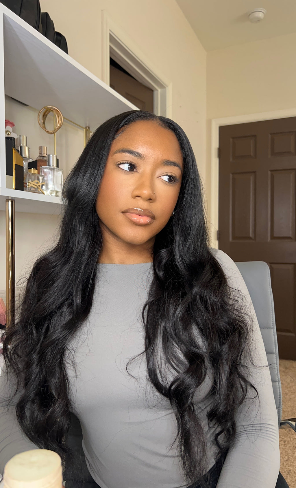 Virgin Malaysian body wave hair texture shown up close against skin