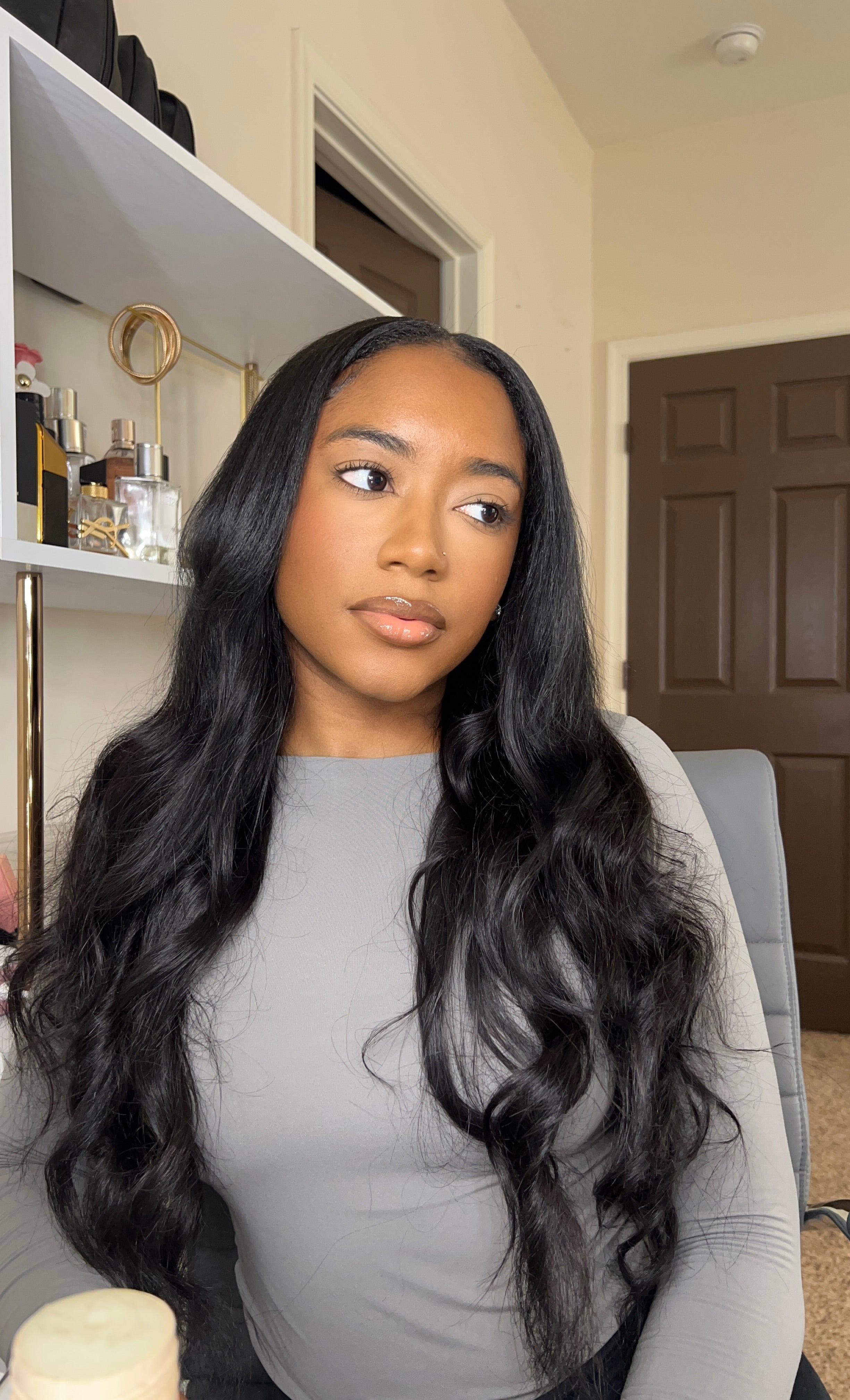 Virgin Malaysian body wave hair texture shown up close against skin