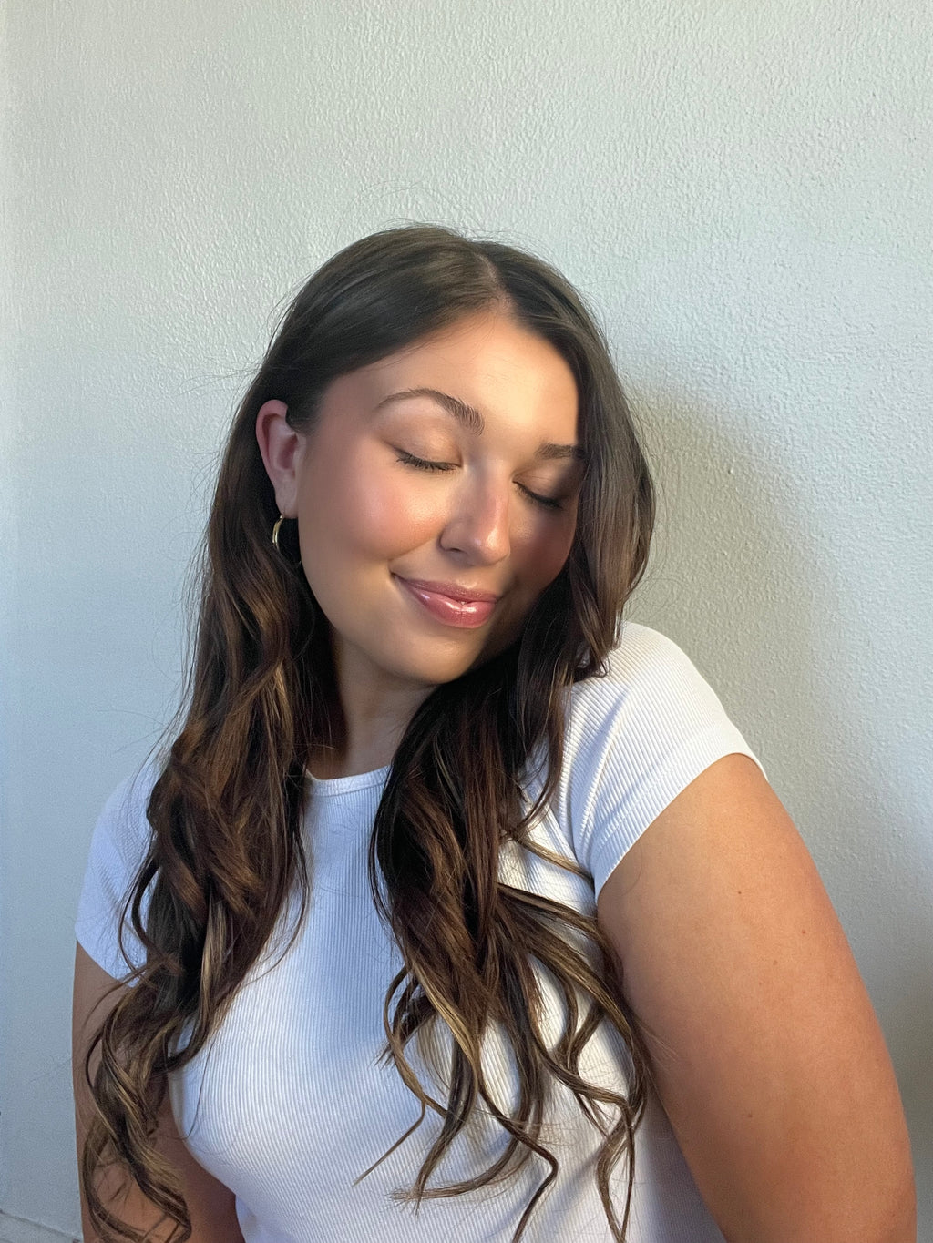 Seamless clip-in hair extension wefts fanned out to show all piece sizes